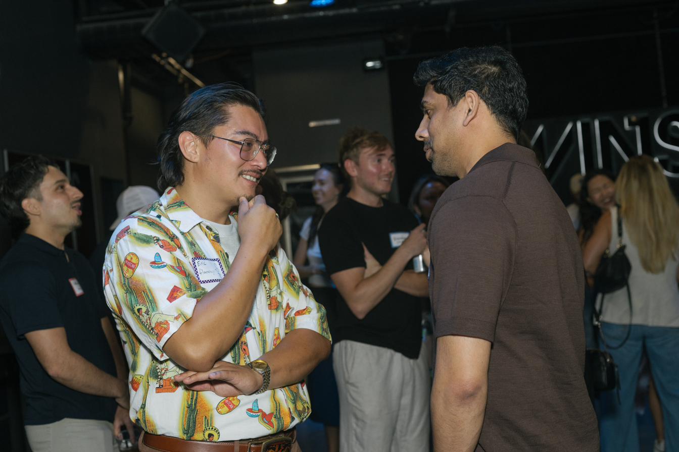 Two attendees deep in conversation